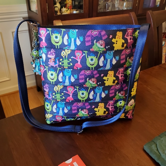 Harveys Handbags - Disney Harvey's Seatbelt Monsters Inc Crossbody